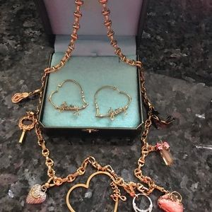Gold Juicy Couture charm necklace with earrings.